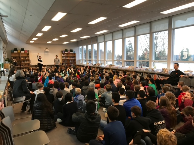 TK Riggins presenting at a school library in Vancouver, BC